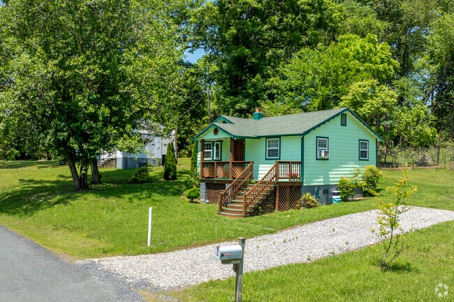 A couple ramblers with gravel driveways and spacious yards in Cumberland.