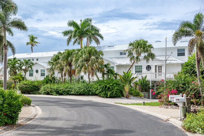 Homes in Bokeelia have a signature coastal style, with colorful plants and blooms.