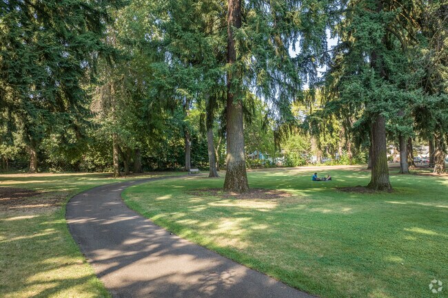 Families enjoy Evergreen Park’s shade and playground in Fourth Plain Village.