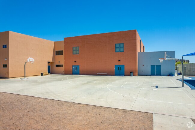 Put your teamwork and skills to the test at Ridgeline Academy's basketball court in New River.