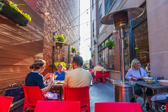 Enjoy dinner with family and friends on the patio at The Stones Common House near Lindenwood.