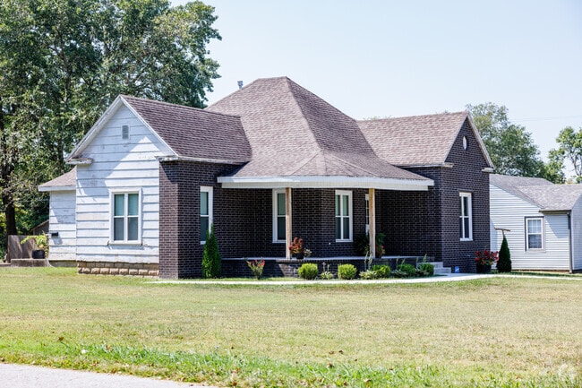 Brick and wood-sided homes appear across Aurora’s neighborhoods.