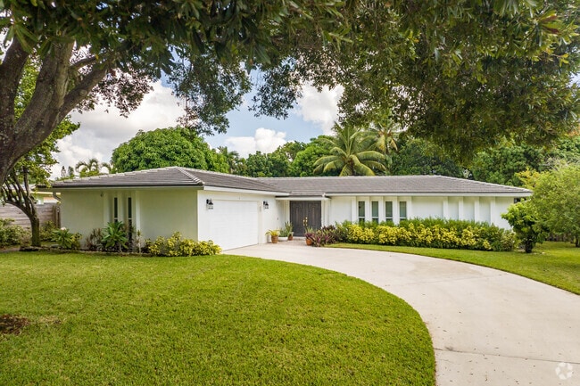 A beautifully landscaped cross gabled ranch home in Monet.