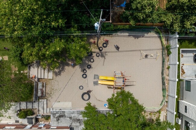 An overview of the colorful playground and sand at Montessori School of Salt Lake.