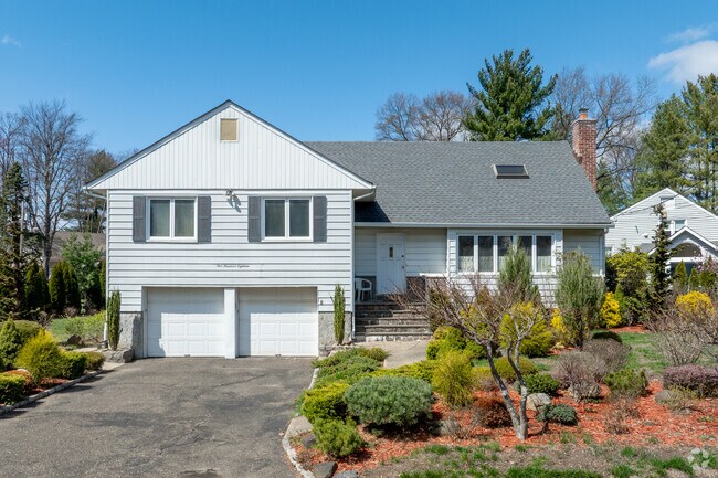 Larger modern homes in Ward Acres benefit from well landscaped yards and larger lots.