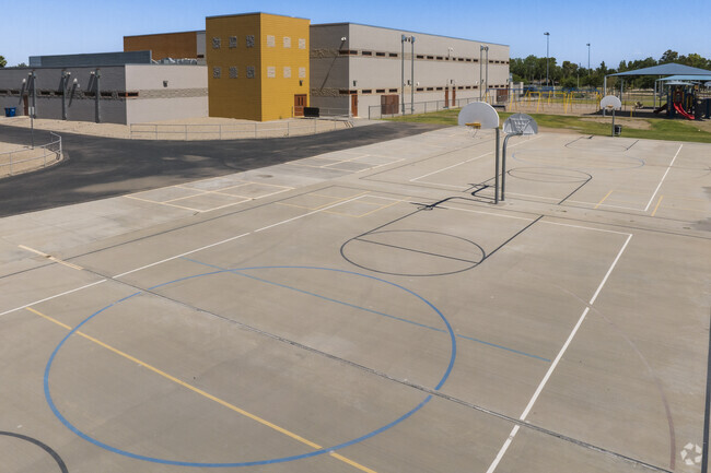 Basketball hoops of various heights can be found at Thew Elementary School in Tempe.