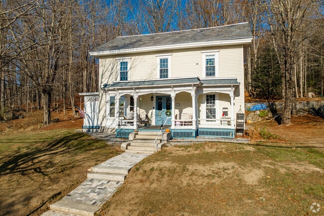 This Goffstown colonial-style features beautiful detailed moulding on the front porch.