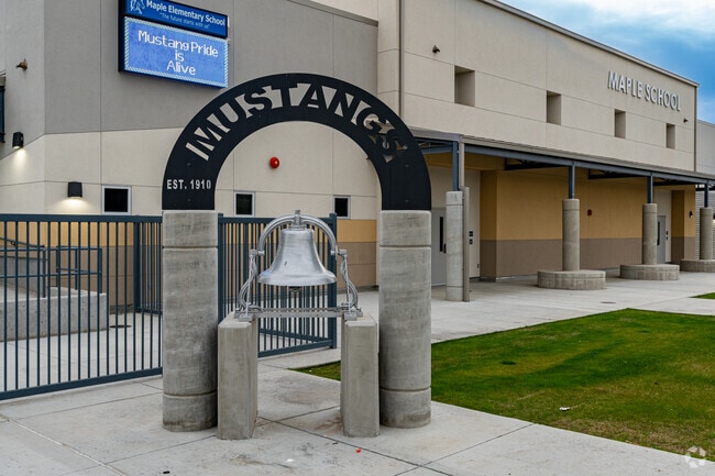 The bell in front of Maple Elementary is not the original but a replacement donated.