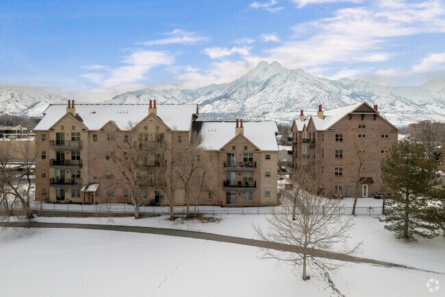 Brick townhomes in Millcreek frame Wasatch Mountain views.