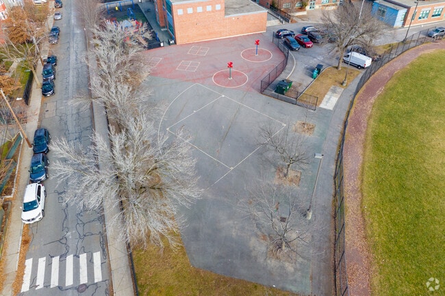 There's a paved area of the schoolyard at Rindge Avenue Upper School in North Cambridge.