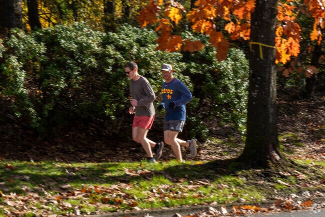 A pair of joggers running by Waluga Park East.