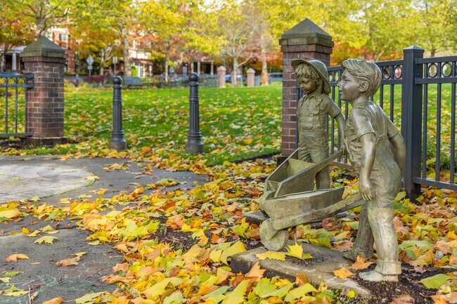 A sculpture of two children greets visitors entering Field Green in Issaquah Highlands.