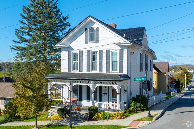 A large Farmhouse rests on a corner in Ebensburg.