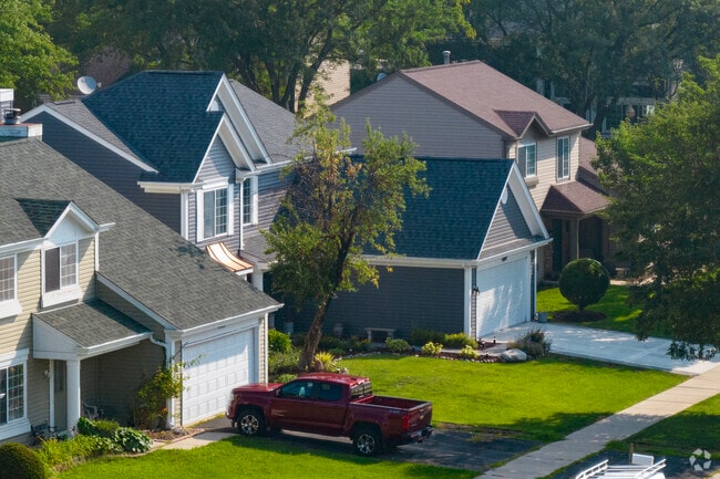 Newly built large single-family homes sit close together in Edgelawn Randall.