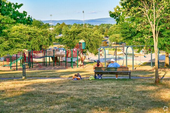 Families gather for outdoor fun at Fairgrounds Park, just minutes from Fountainhead-Orchard Hills.