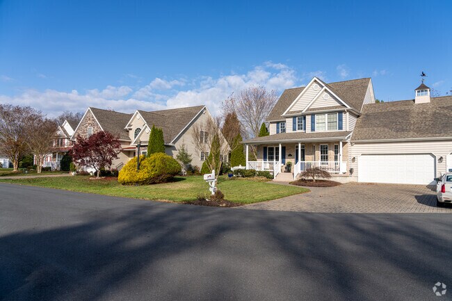 A cupola tops off a garage in this row of colonial-style homes in Ocean View.