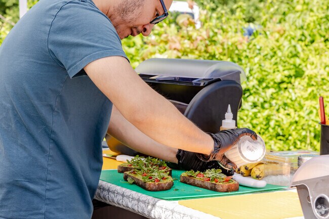 Food trucks and other food vendors participate in the Geneva French Market.