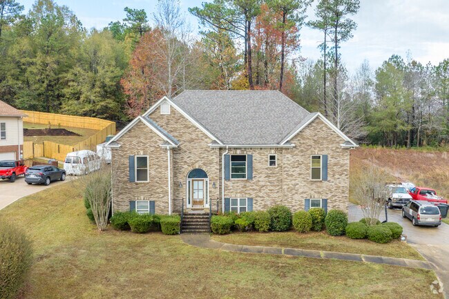Large craftsman style houses look over the quiet streets of Harpersville.