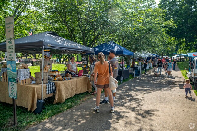 Visitors shop the locally made goods from vendors at the Belmont Farmers Market.