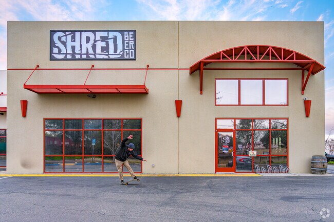 Skater shreds in front of Shred Beer Company in Old Town Rocklin as he awaits store opening.