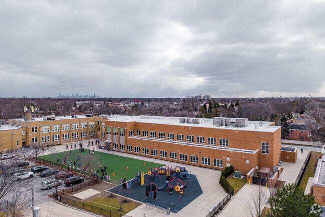 Children playing at recess at Oriole Park Elementary School.