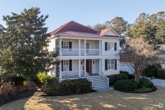 Lush landscaping complements the natural beauty of the coastal setting.