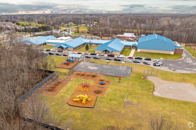 An expansive play area is just across from the pickup area at Brown Elementary School.
