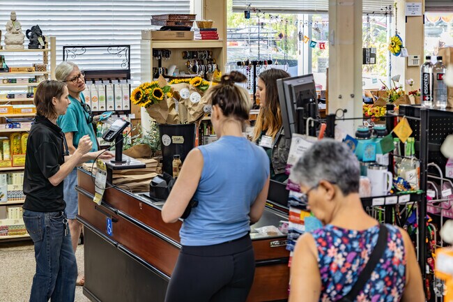 Residents stop at Integral Yoga Natural Foods in Rose Hill for quick fresh groceries.