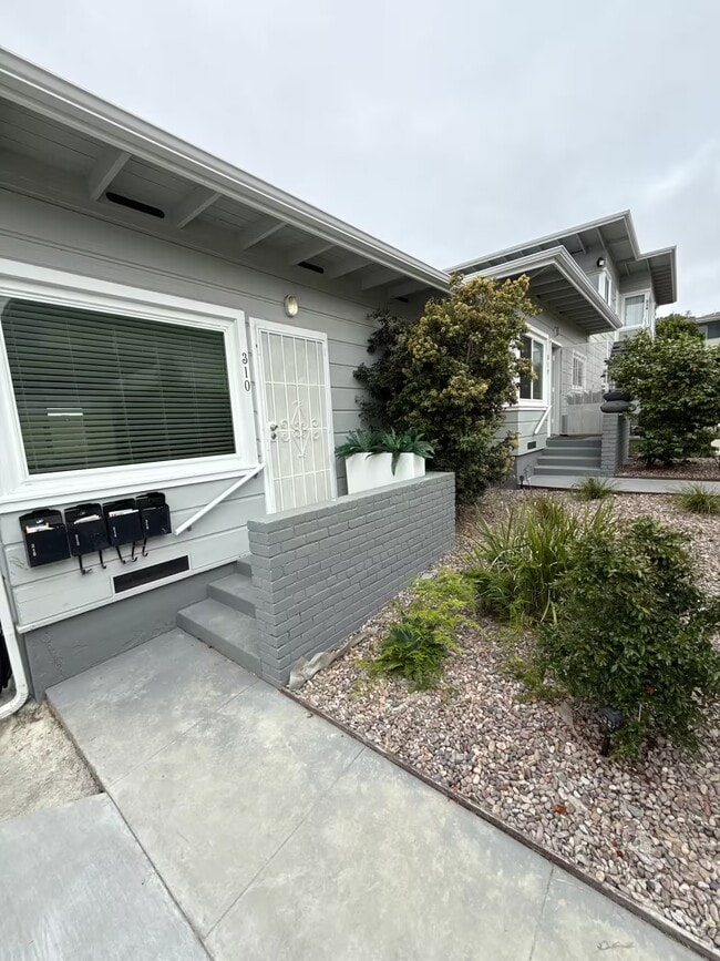 Landscaped front entrance and mailboxes.