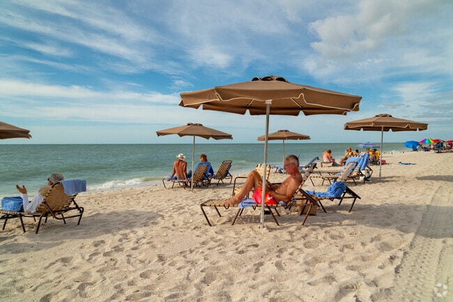 The sandy shores of Vanderbilt Beach Park offer water's edge relaxation daily.