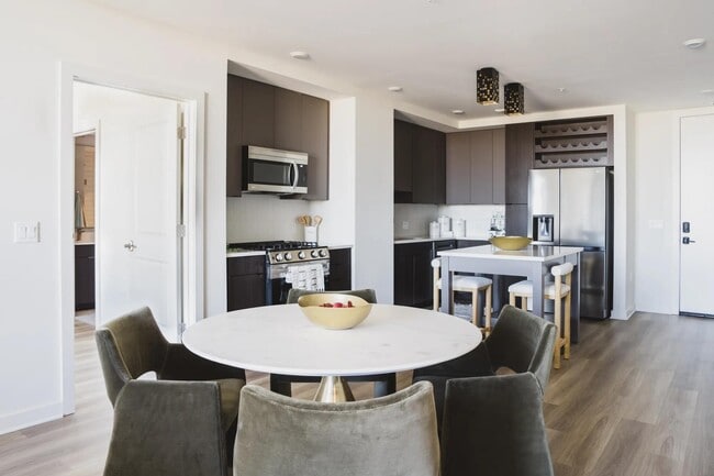 Cook in style with gourmet kitchens, single basin sinks and sleek tile backsplash.