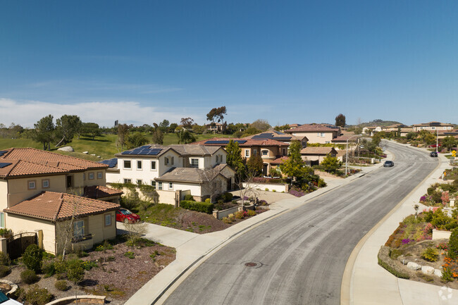 Beautifully maintained streets with diverse modern Mediterranean homes in Arrowood Morro Hills.