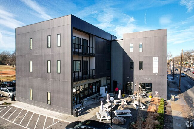 Modern storefronts reside above apartment complexes near the Westover Hills West region.
