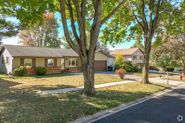 Rows of homes within Algonquin Heights are located on quiet streets with mature trees.