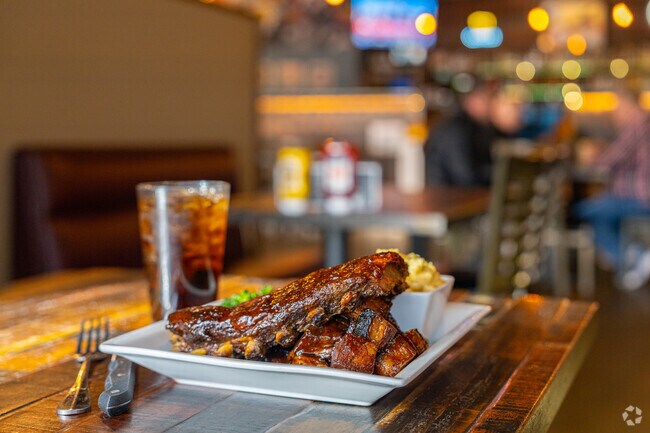 Black Dog Bar and Grill specializes in slow-smoked barbecue dishes.