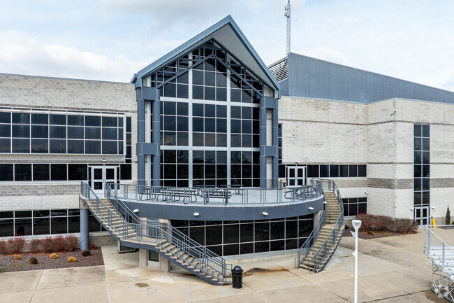 The exterior cafeteria of Troy Buchanan High School faces the football field.