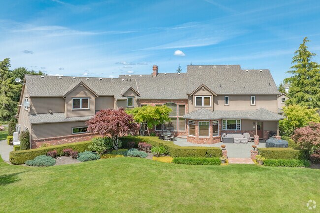 Large custom homes sit on the hill overlooking the Veazie area.