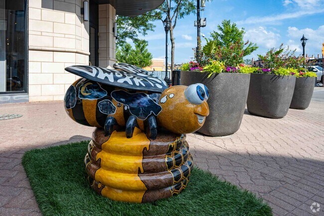 Near Saddle Creek the Downtown Naperville Alliance has organized a summer bug sculpture exhibit.