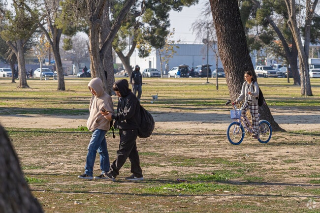 Students in Lakeview walk through Martin Luther King Jr. Park on their way home.