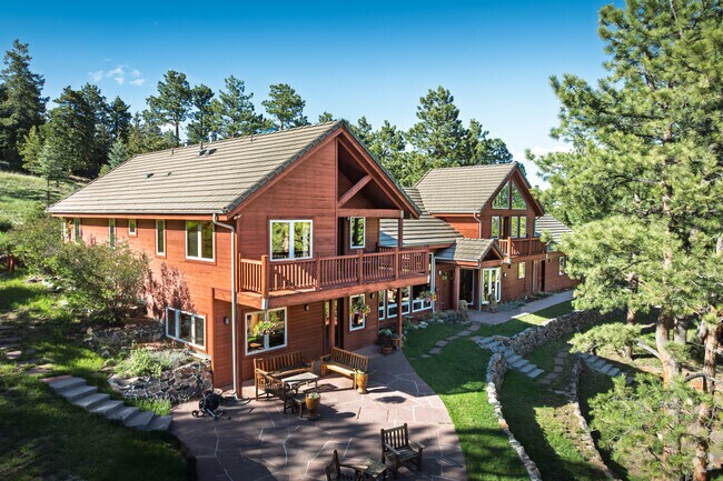 A spacious home with panoramic mountain views is seen hillside in Soda Creek.