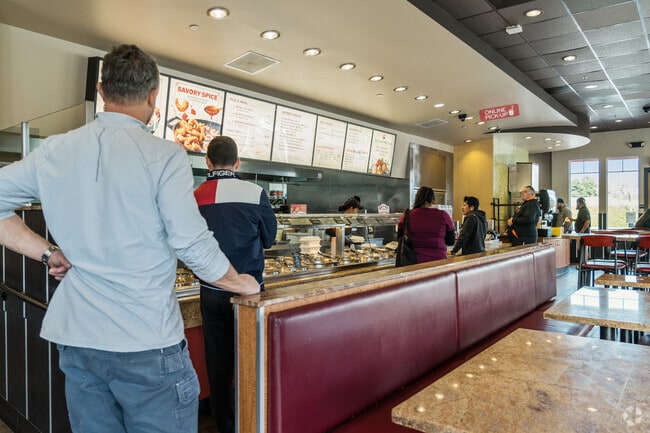 A Panda Express queue builds as an eager lunchtime crowd waits in Homeview.