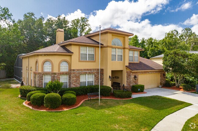 Clay Gully, Fl - Two story single family home with brick facade