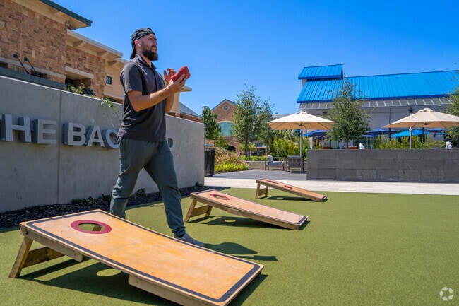Patio games and gathering spaces enliven The Shops at Highland Village.