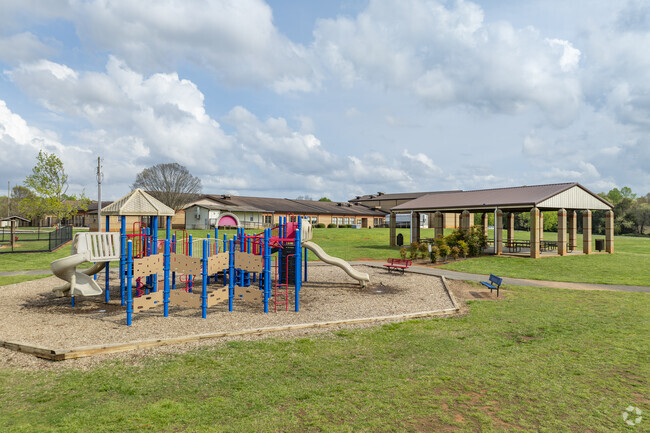 The Springmore Elementary School features large outdoor playgrounds and activity areas.