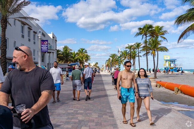 Residents love to walk down the Hollywood Beach boardwalk.