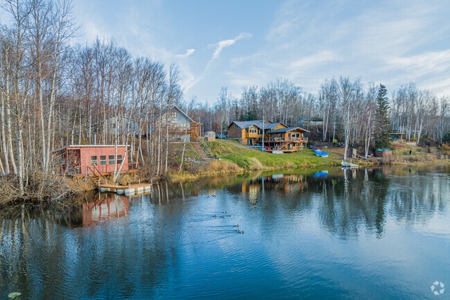 A row of lakefront homes in North Lakes captures the morning light after a cold night.