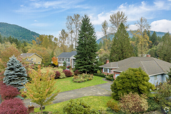 Squak Mountain houses sit in small rustic groupings at the end of country roads.
