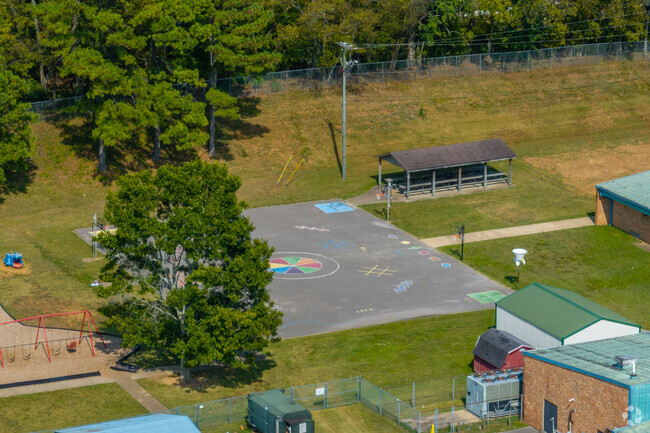 Spring Hill Elementary School has a courtyard with basketball and games.