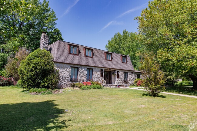 A stately Mansard style home brings architectural variety to Harrison.