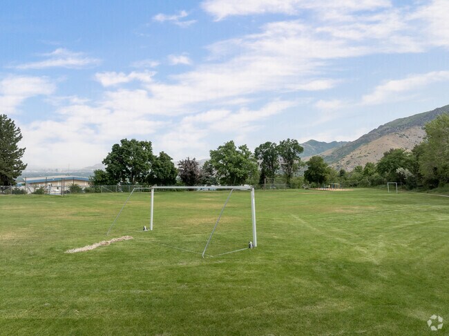 A large grassy soccer field at Oakridge Elementary School for students.